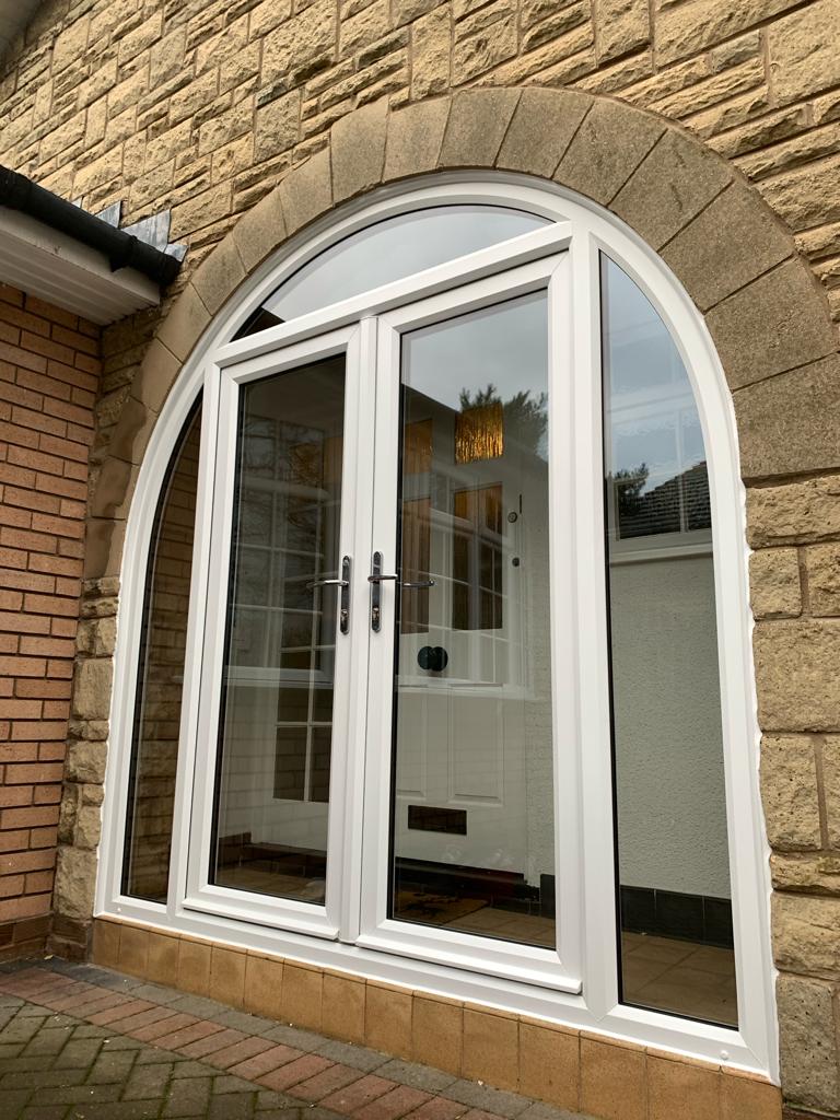 French doors with arched side frames in white PVC supplied and fitted in Formby, Liverpool