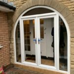 French doors with arched side frames in white PVC supplied and fitted in Formby, Liverpool