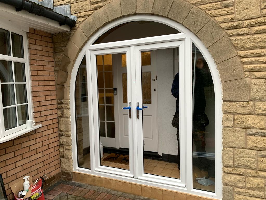 French doors with arched side frames in white PVC supplied and fitted in Formby, Liverpool