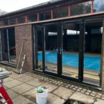 We recently completed a striking installation in Burscough, fitting a set of black PVCu French doors, matching windows and sidelights into a dedicated swimming pool room.