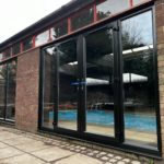 We recently completed a striking installation in Burscough, fitting a set of black PVCu French doors, matching windows and sidelights into a dedicated swimming pool room.