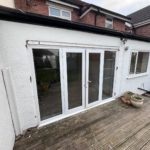 We recently completed a feature installation at a property in Ainsdale, Southport, Liverpool, Manchester, Blackburn, Lancaster, Ormskirk, Preston - fitting a set of white Crittall-style French doors with matching sidelights to create a striking and elegant rear elevation.