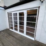 We recently completed a feature installation at a property in Ainsdale, Southport, Liverpool, Manchester, Blackburn, Lancaster, Ormskirk, Preston - fitting a set of white Crittall-style French doors with matching sidelights to create a striking and elegant rear elevation.