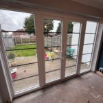 We recently completed a feature installation at a property in Ainsdale, Southport, Liverpool, Manchester, Blackburn, Lancaster, Ormskirk, Preston - fitting a set of white Crittall-style French doors with matching sidelights to create a striking and elegant rear elevation.