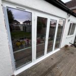 We recently completed a feature installation at a property in Ainsdale, Southport, Liverpool, Manchester, Blackburn, Lancaster, Ormskirk, Preston - fitting a set of white Crittall-style French doors with matching sidelights to create a striking and elegant rear elevation.