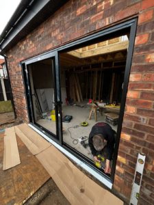 We recently completed the installation of a two-panel black aluminium sliding door at a new build property in Chester, creating a sleek and contemporary connection between the interior living space and the garden. We supply and fit aluminium patio doors in Southport, Ormskirk, Liverpool, Chester, Manchester, Bolton, Blackburn, Preston, Lancaster and all surrounding areas in the Northwest.