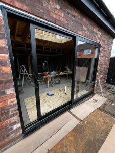We recently completed the installation of a two-panel black aluminium sliding door at a new build property in Chester, creating a sleek and contemporary connection between the interior living space and the garden. We supply and fit aluminium patio doors in Southport, Ormskirk, Liverpool, Chester, Manchester, Bolton, Blackburn, Preston, Lancaster and all surrounding areas in the Northwest.