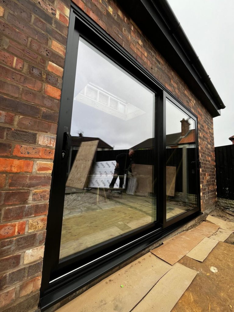 We recently completed the installation of a two-panel black aluminium sliding door at a new build property in Chester, creating a sleek and contemporary connection between the interior living space and the garden. We supply and fit aluminium patio doors in Southport, Ormskirk, Liverpool, Chester, Manchester, Bolton, Blackburn, Preston, Lancaster and all surrounding areas in the Northwest.