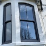 PVC sliding sash windows with Georgian bars