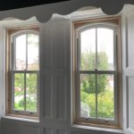 PVC sliding sash windows with Georgian bars