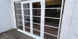 We recently completed a feature installation at a property in Ainsdale, Southport, Liverpool, Manchester, Blackburn, Lancaster, Ormskirk, Preston - fitting a set of white Crittall-style French doors with matching sidelights to create a striking and elegant rear elevation.
