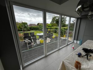 We recently completed a project in Southport, supplying and fitting a set of white aluminium bi-fold doors (four panels) to create a seamless connection between the home and garden.