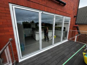 We recently completed a project in Southport, supplying and fitting a set of white aluminium bi-fold doors (four panels) to create a seamless connection between the home and garden.