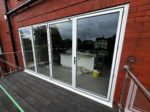 We recently completed a project in Southport, supplying and fitting a set of white aluminium bi-fold doors (four panels) to create a seamless connection between the home and garden.