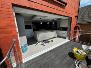 We recently completed a project in Southport, supplying and fitting a set of white aluminium bi-fold doors (four panels) to create a seamless connection between the home and garden.