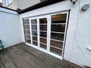 We recently completed a feature installation at a property in Ainsdale, Southport, Liverpool, Manchester, Blackburn, Lancaster, Ormskirk, Preston - fitting a set of white Crittall-style French doors with matching sidelights to create a striking and elegant rear elevation.