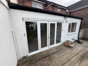 We recently completed a feature installation at a property in Ainsdale, Southport, Liverpool, Manchester, Blackburn, Lancaster, Ormskirk, Preston - fitting a set of white Crittall-style French doors with matching sidelights to create a striking and elegant rear elevation.