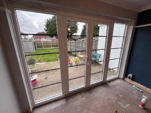 We recently completed a feature installation at a property in Ainsdale, Southport, Liverpool, Manchester, Blackburn, Lancaster, Ormskirk, Preston - fitting a set of white Crittall-style French doors with matching sidelights to create a striking and elegant rear elevation.