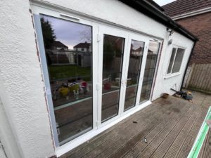 We recently completed a feature installation at a property in Ainsdale, Southport, Liverpool, Manchester, Blackburn, Lancaster, Ormskirk, Preston - fitting a set of white Crittall-style French doors with matching sidelights to create a striking and elegant rear elevation.