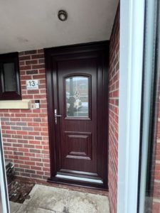 We removed all the timber windows, doors and fascia boards on this house in Skelmersdale and replaced them with beautiful rosewood on white PVC.