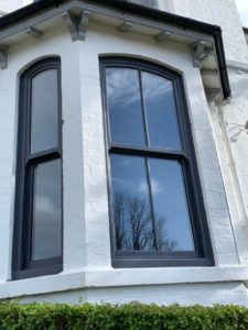 PVC sliding sash windows with Georgian bars