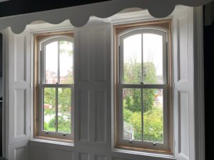 PVC sliding sash windows with Georgian bars